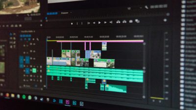 Close-up of a video editing timeline interface on a computer screen, showcasing professional software in action.